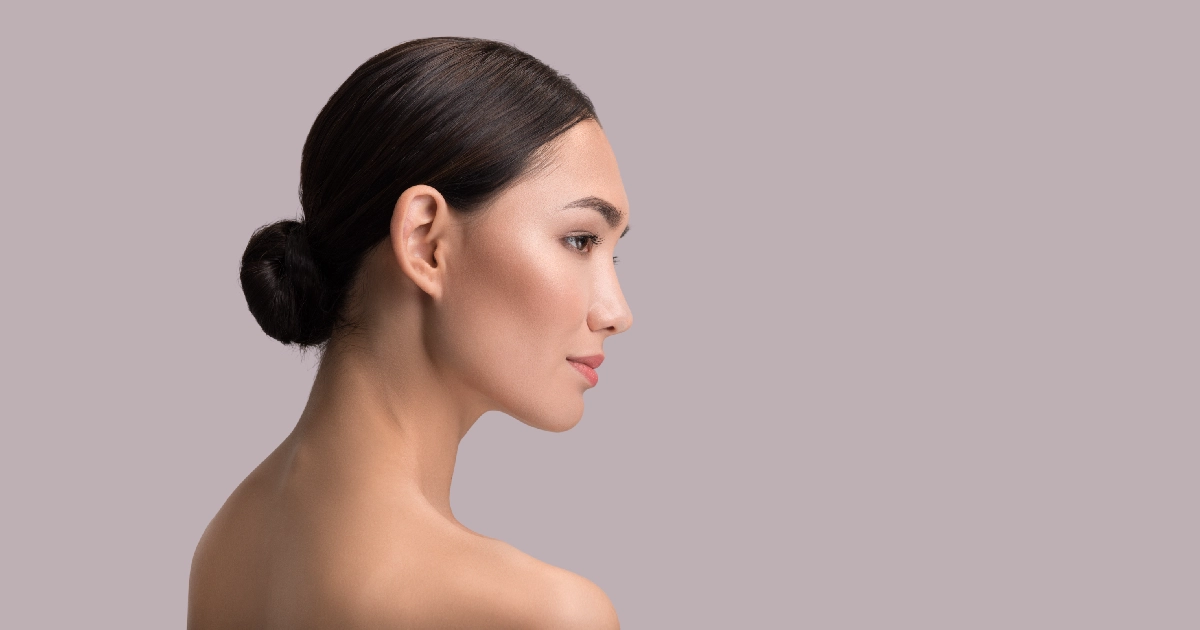Side profile of a woman showing a defined chin and jawline